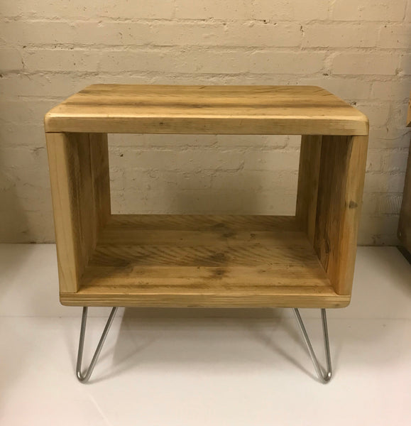 Rustic vinyl record storage unit constructed from reclaimed scaffold boards on zinc hairpin legs